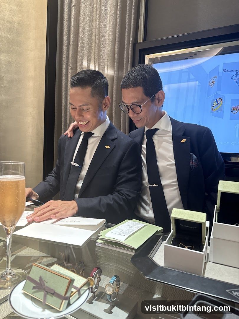 Two men in suits looking at documents