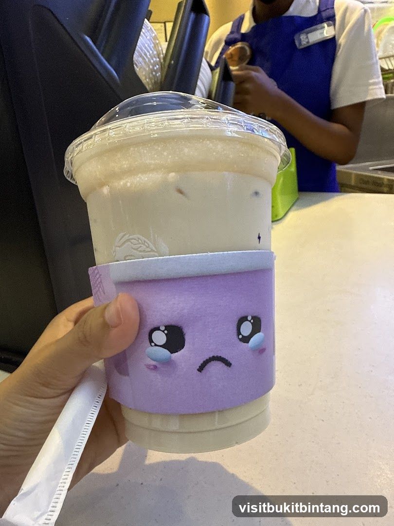 Beverage with Sad Face Sleeve