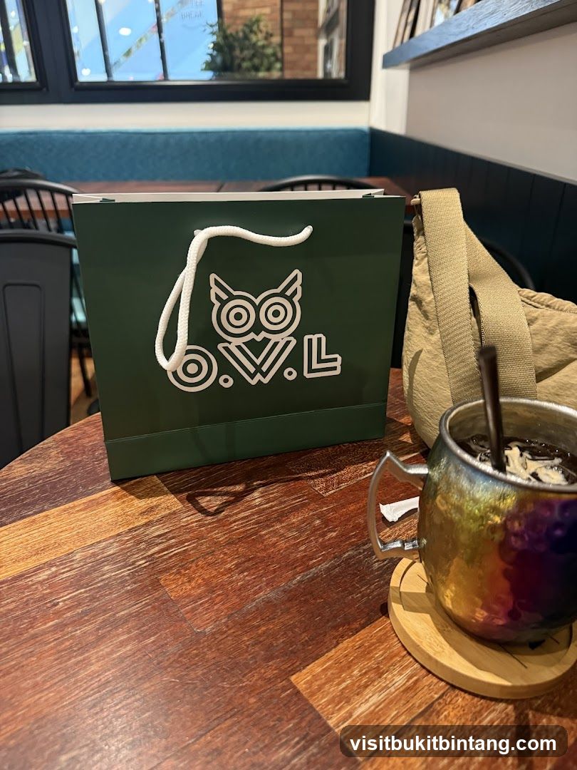 Shopping bag and drink on table
