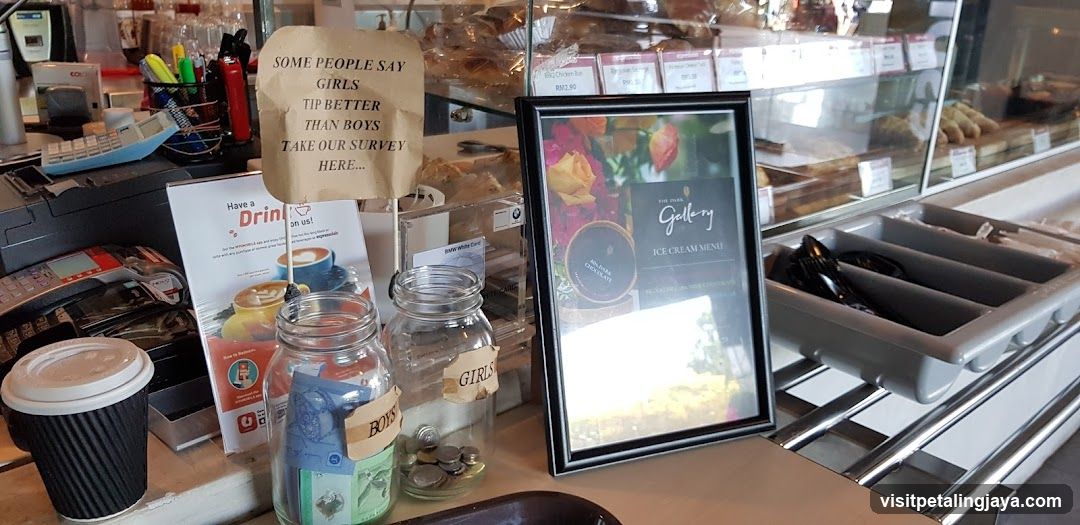 Counter display with donation jars and menu board