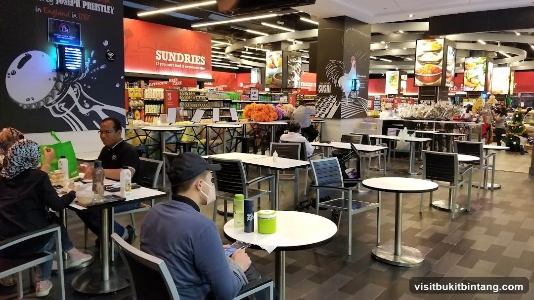 Indoor seating area with retail shelves in the background