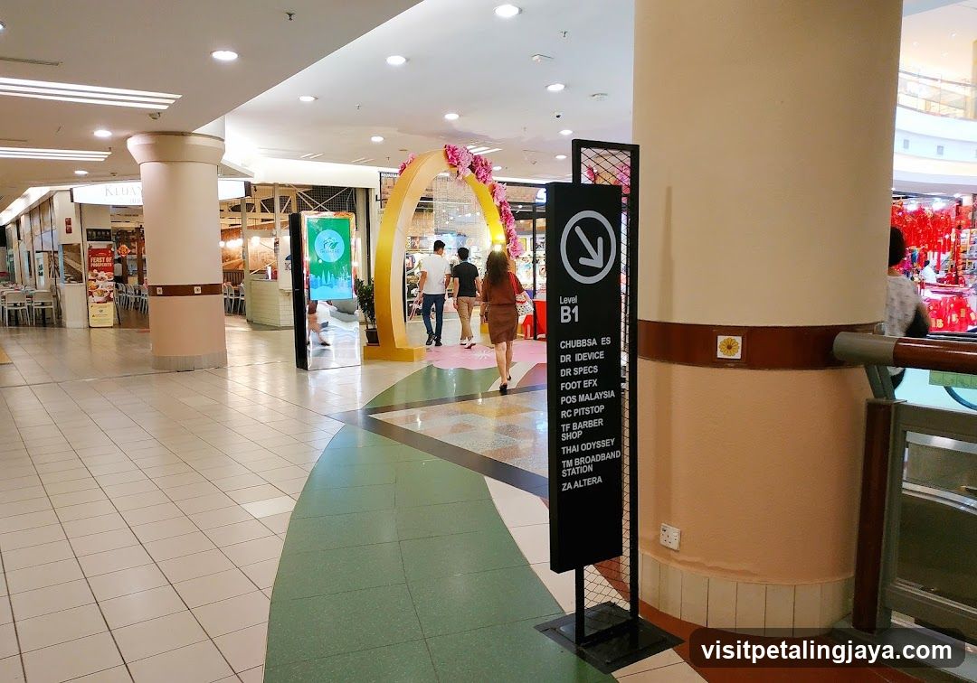Shopping Mall Interior with Signage and Decorative Archway