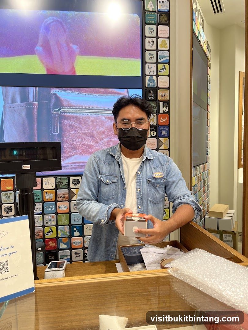 Man holding a Fossil product