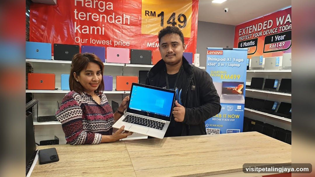 Laptop Store Interior with Staff Displaying Product