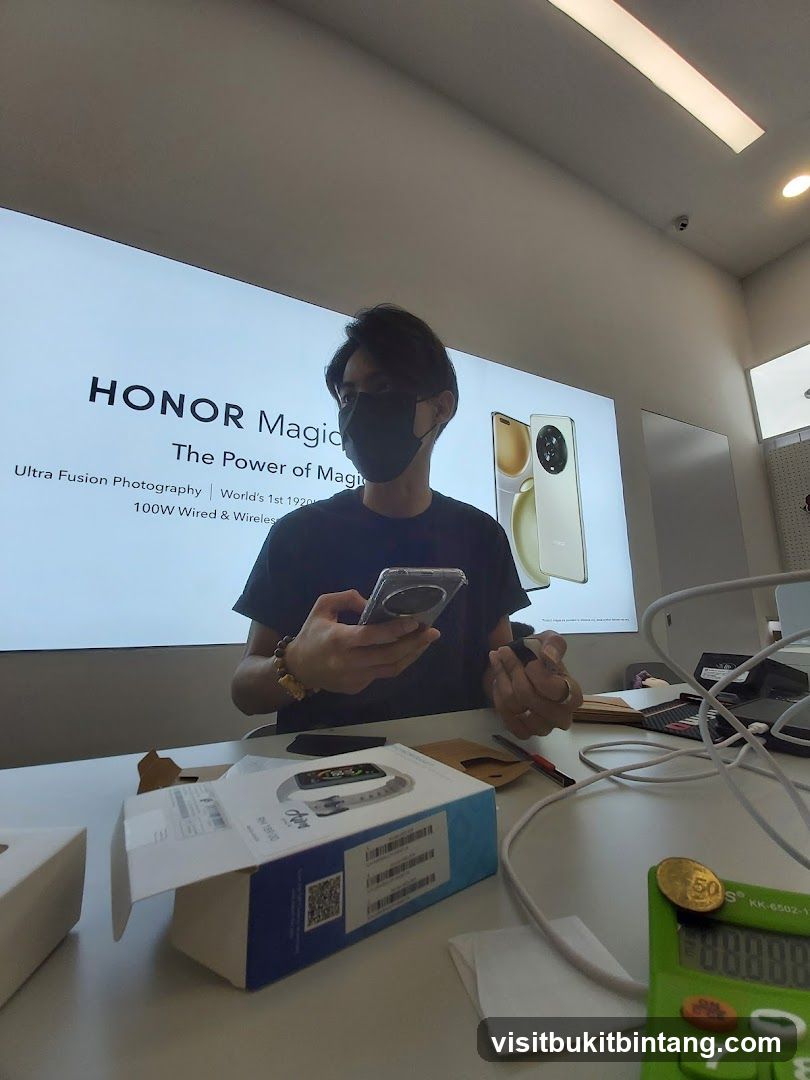 Man holding a phone in front of a HONOR Magic advertisement