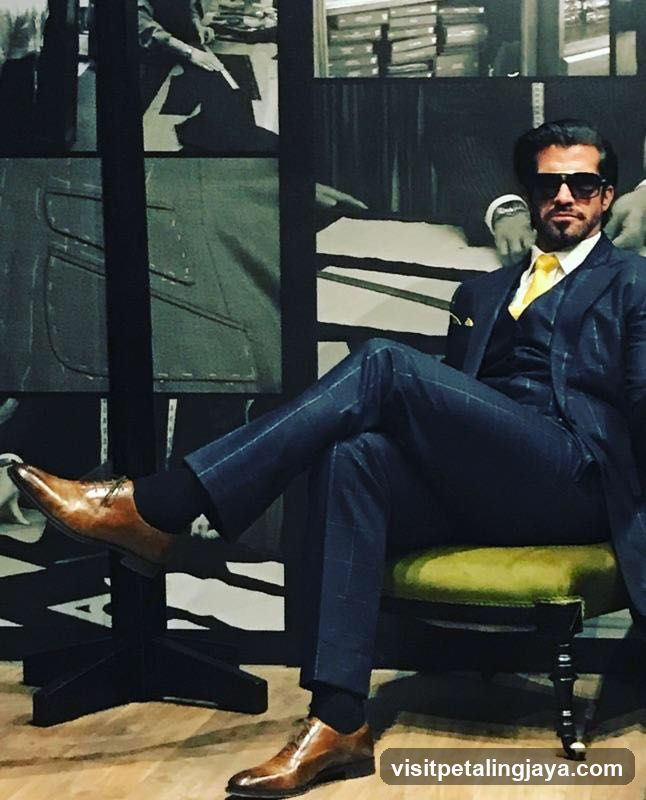 Man in Suit Sitting on Chair