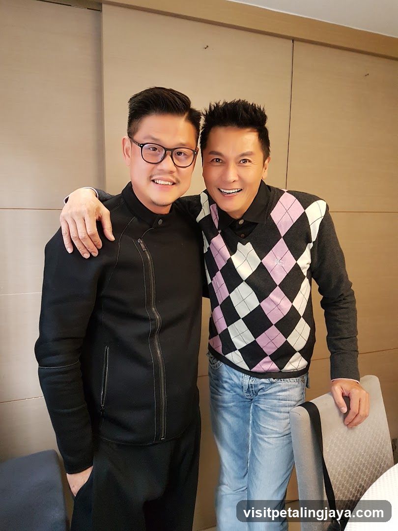 Two men posing together indoors