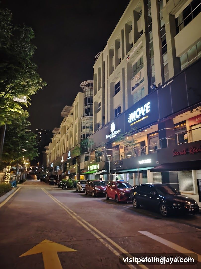 Night street scene with shops
