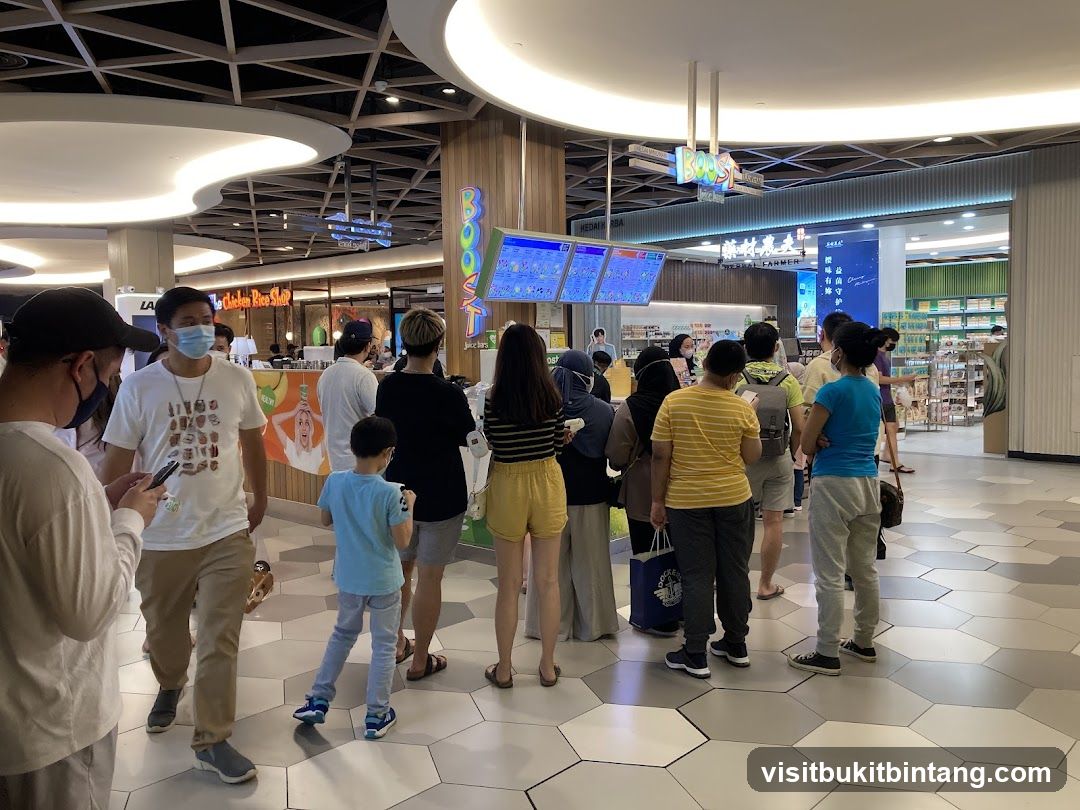 People queuing at a food stall