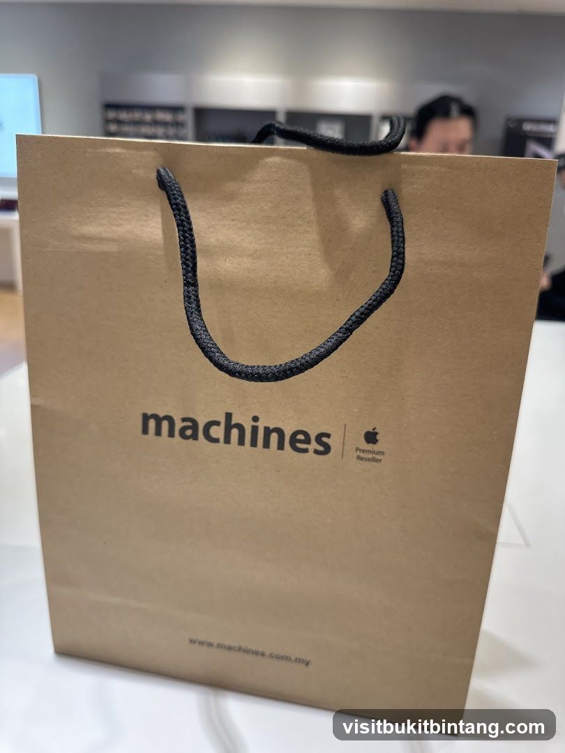 Brown paper shopping bag with "machines" logo