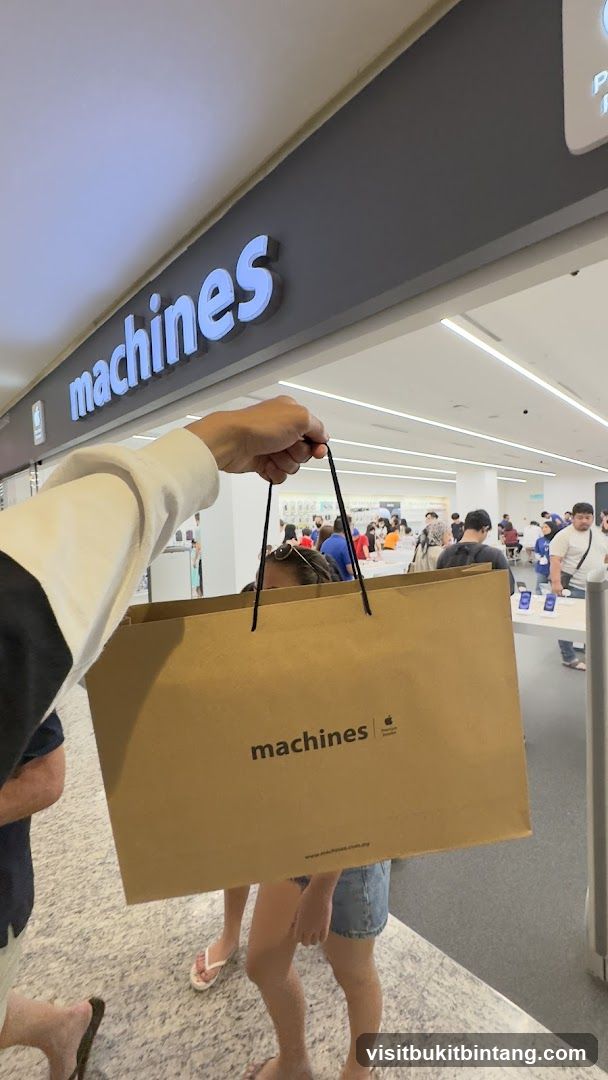 Person holding a shopping bag in front of a store