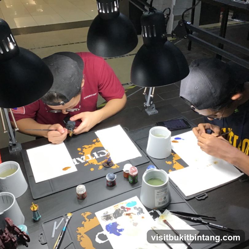 Hobbyists painting miniatures