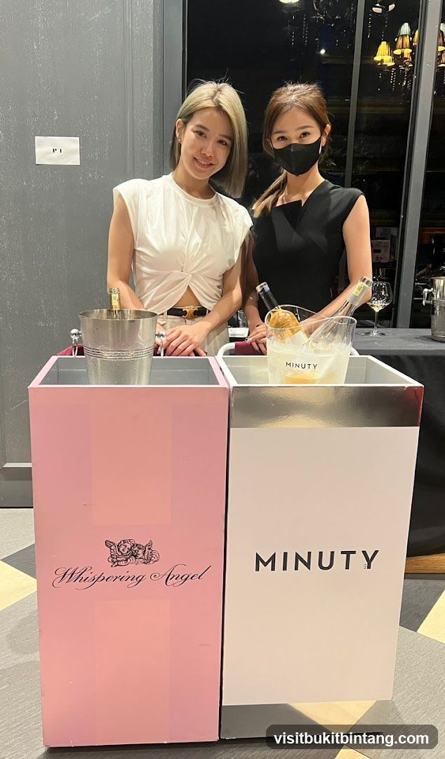 Two women at a beverage station