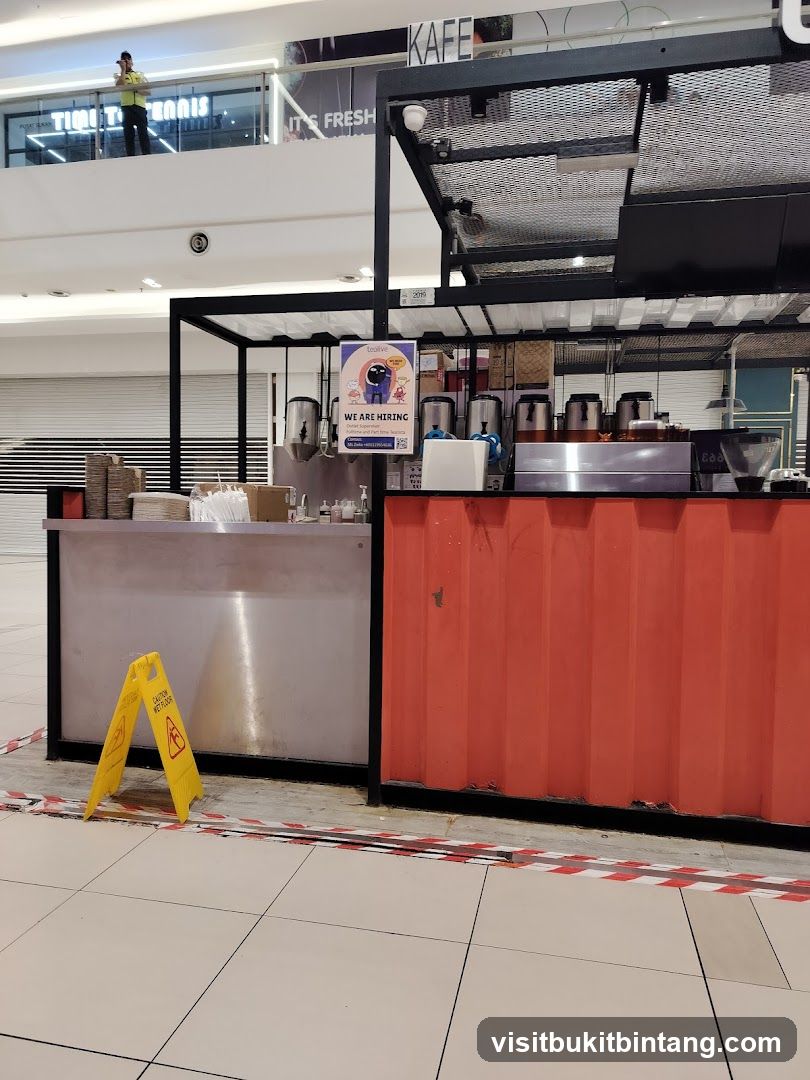 Coffee stand with hiring sign