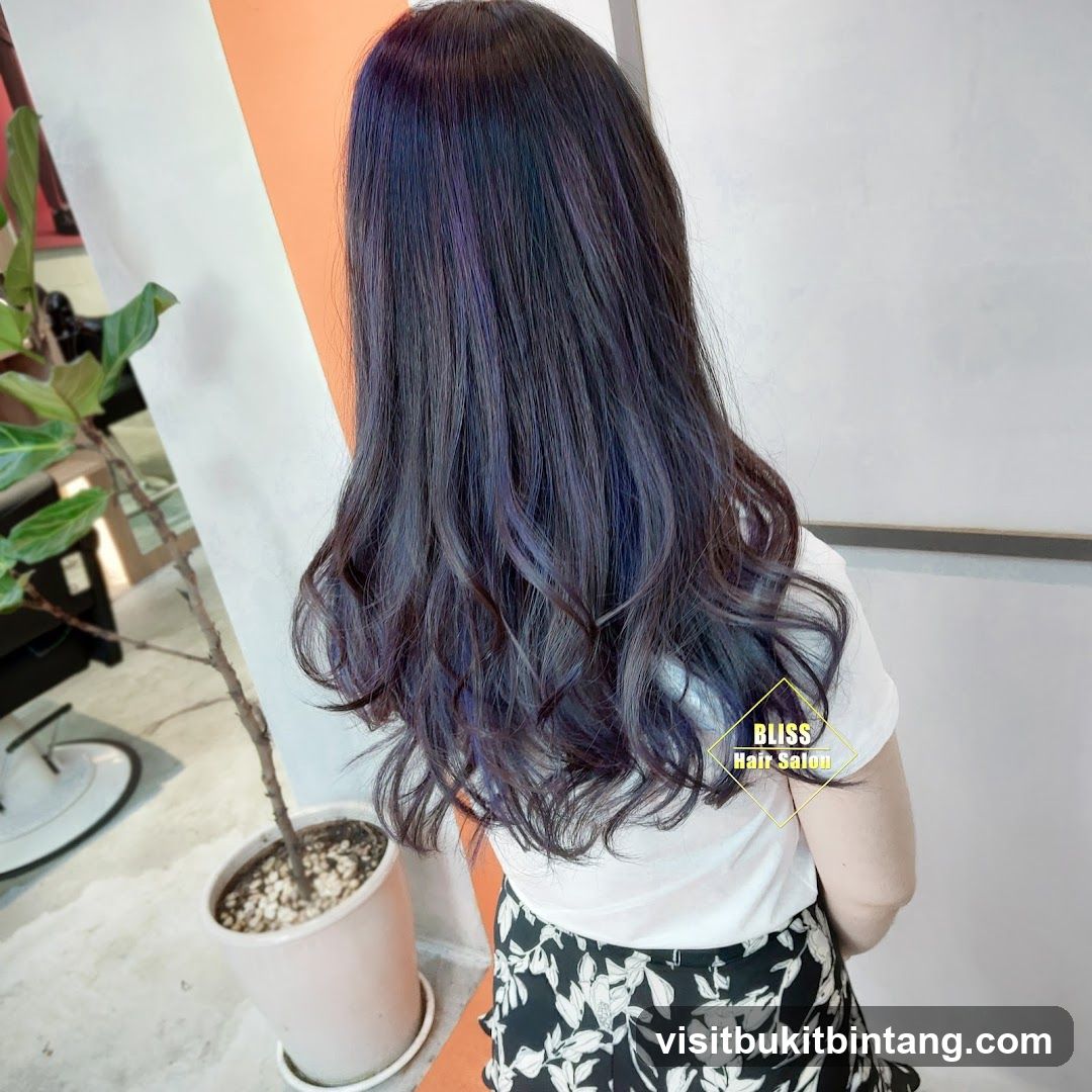 Woman with dark hair with purple highlights