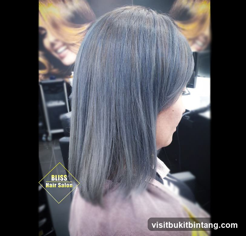 Woman with gray hair at salon
