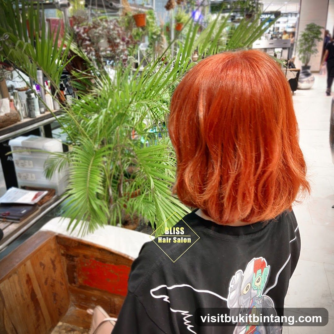 Woman with Orange Hair in Salon