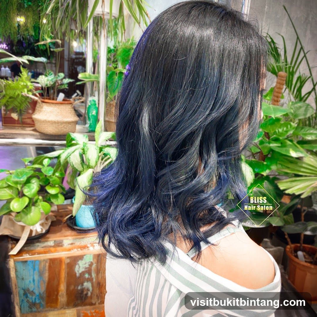 Woman with Blue-Toned Hair in a Salon