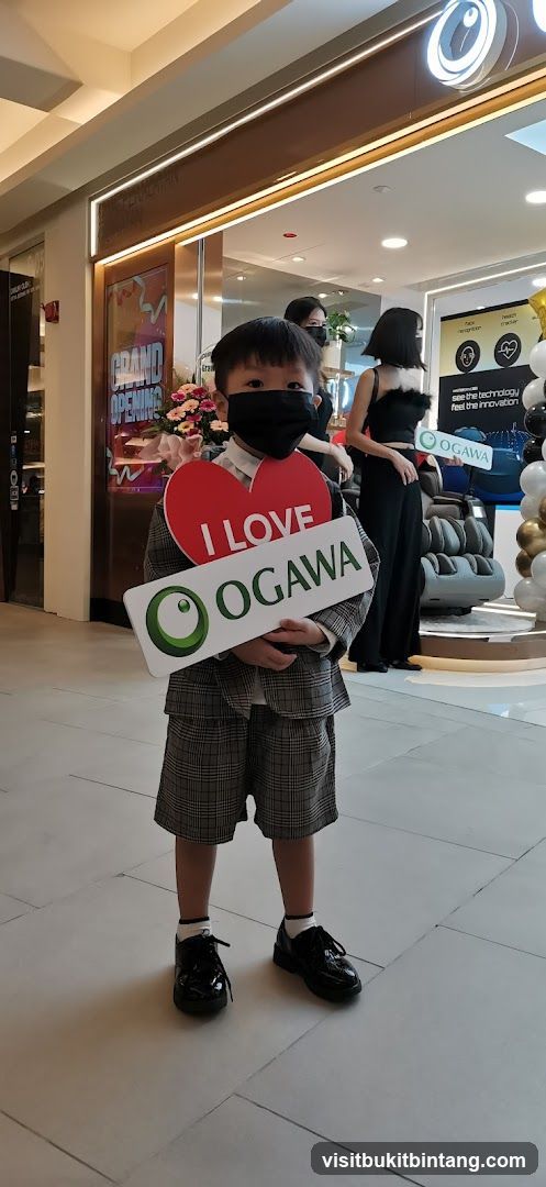 Child holding "I LOVE OGAWA" sign