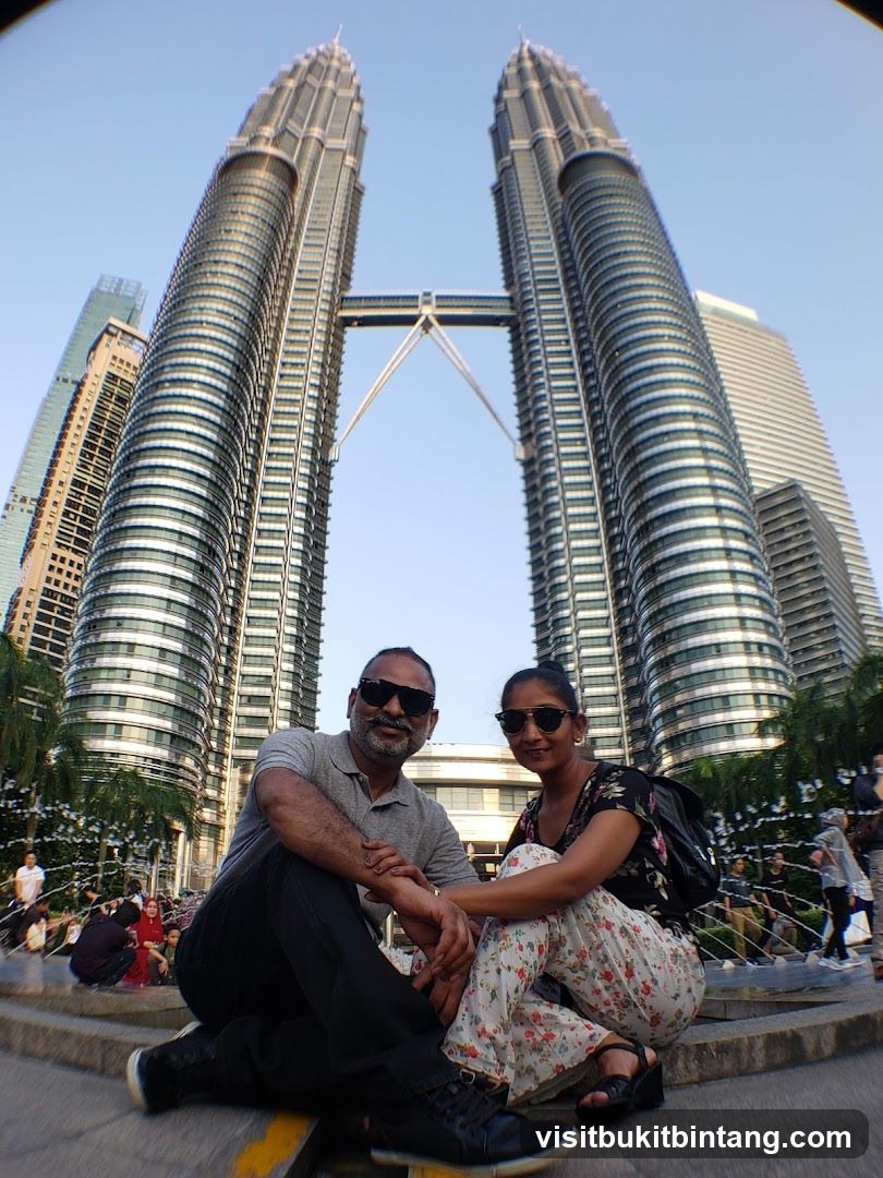 Couple Posing in Front of Petronas Towers