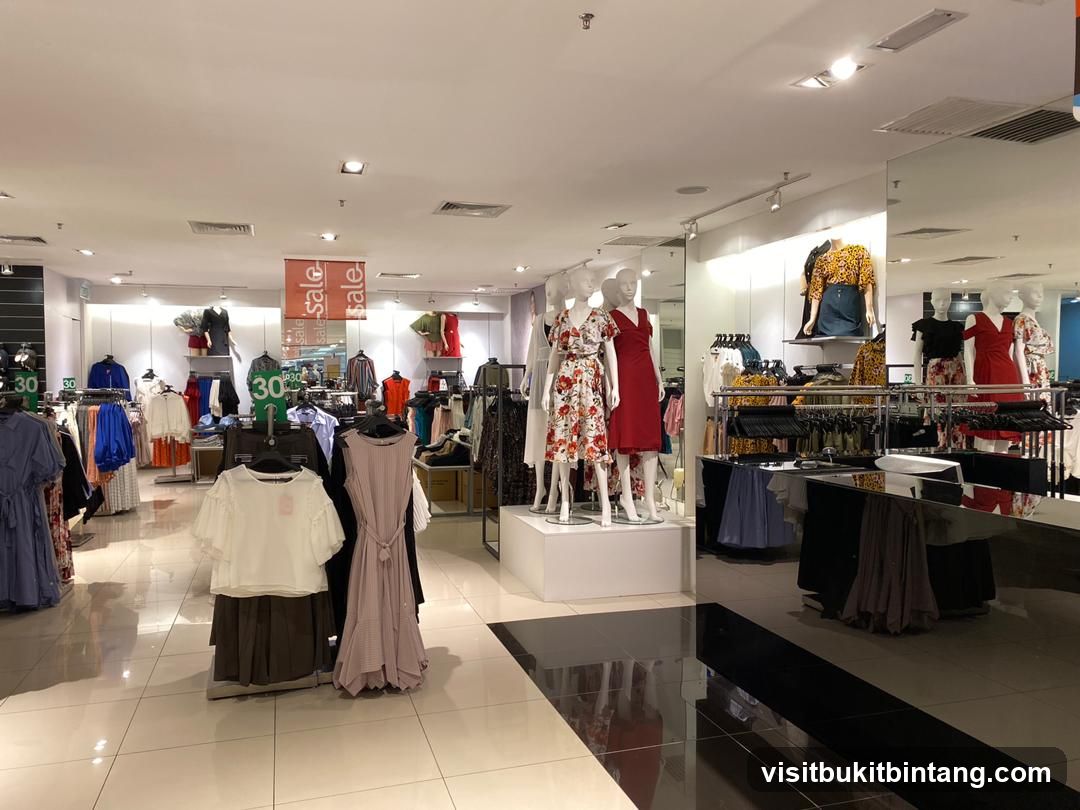 Clothing store interior with mannequins and sale signs
