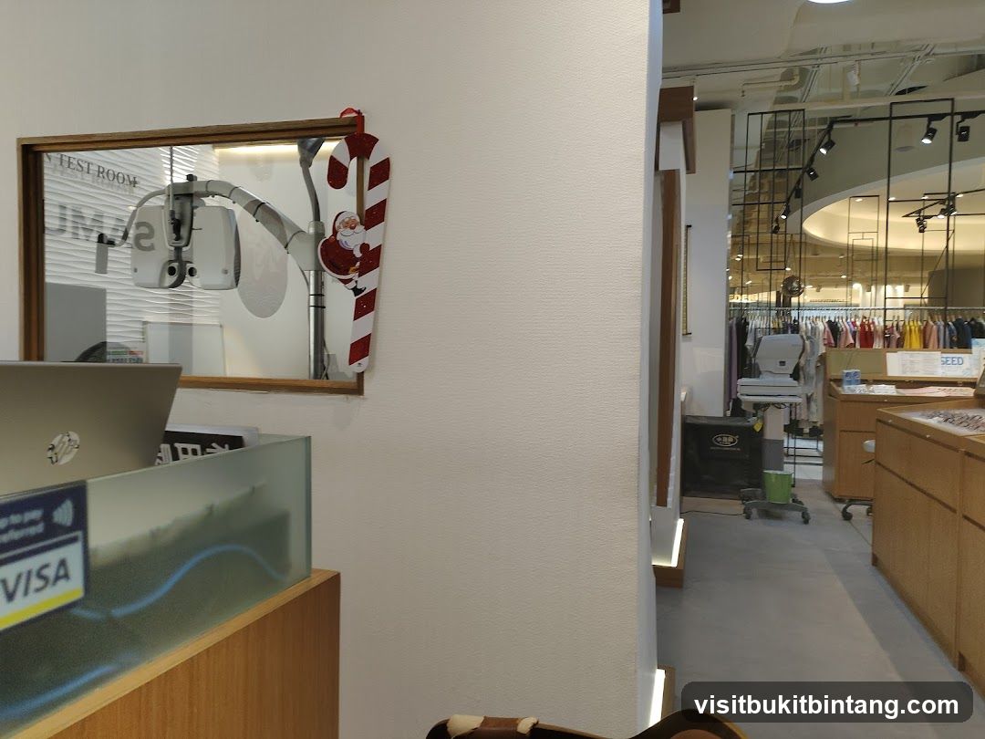 Interior of a retail store with optical equipment and clothing displays