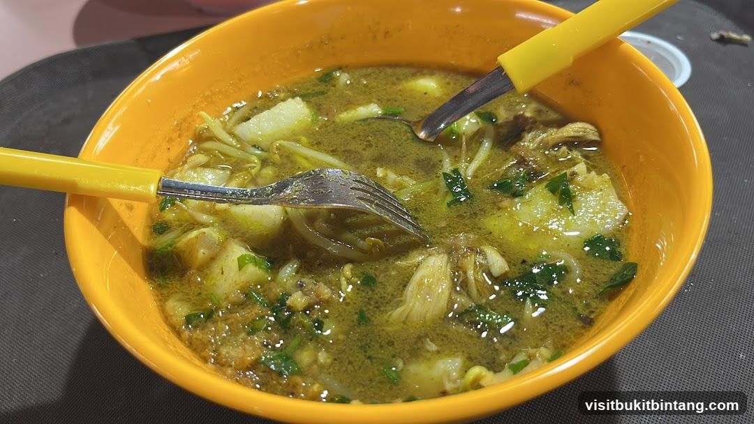 Bowl of Soup with Spoons