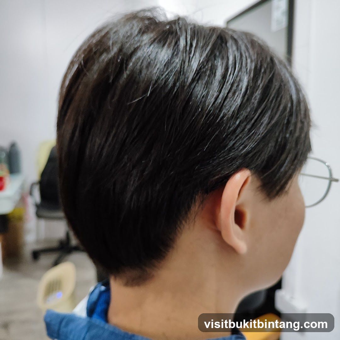 Close-up of a person's haircut
