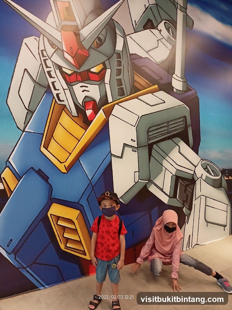 Children Posing in Front of Gundam Mural