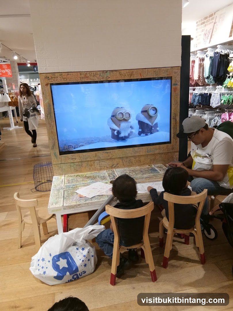 Children watching TV in a store