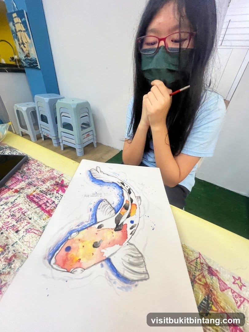 Young artist painting a koi fish