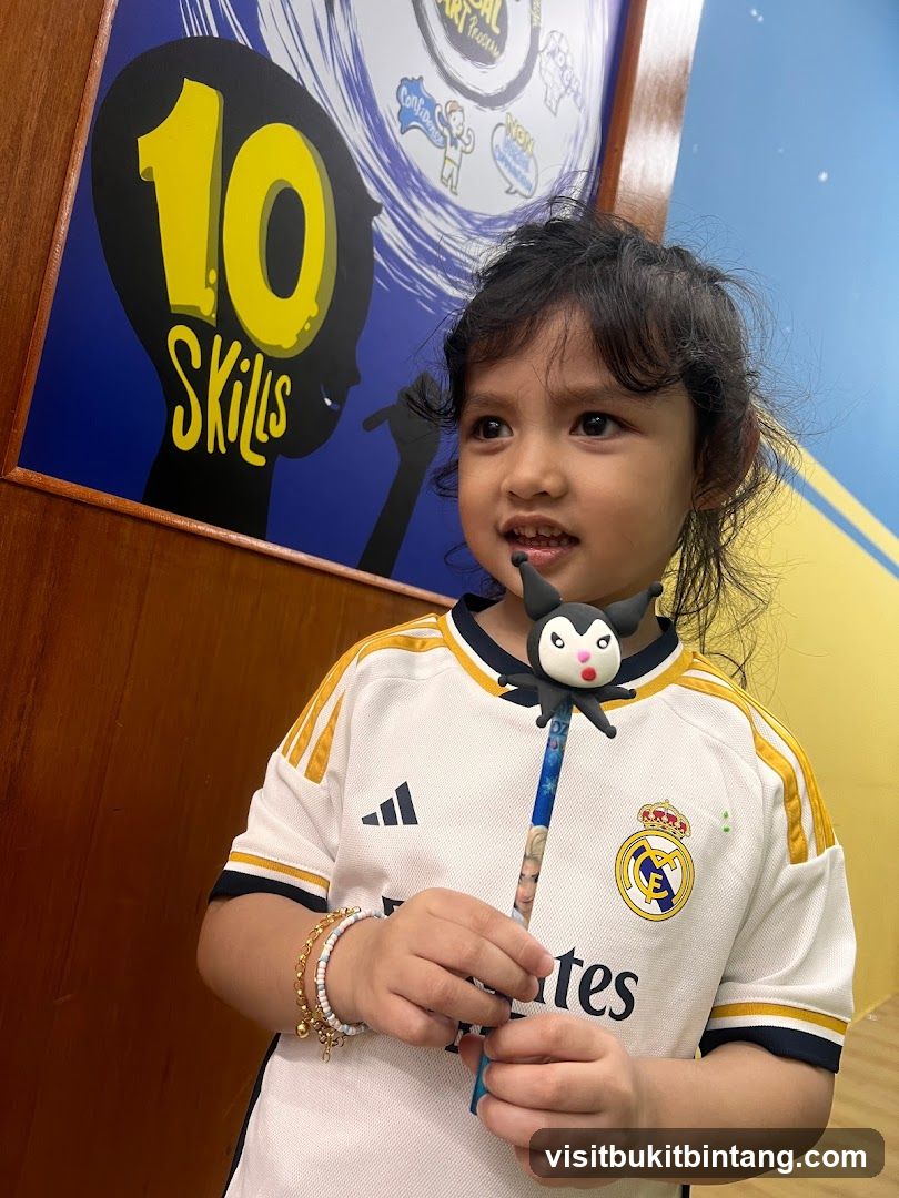 Child with a wand and a poster