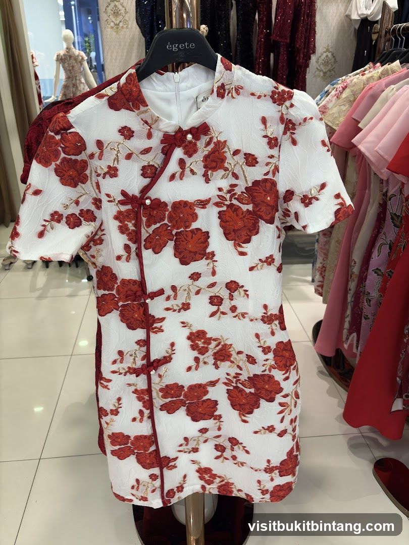 White dress with red floral pattern
