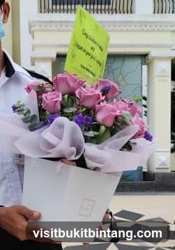 Flower bouquet with congratulatory card