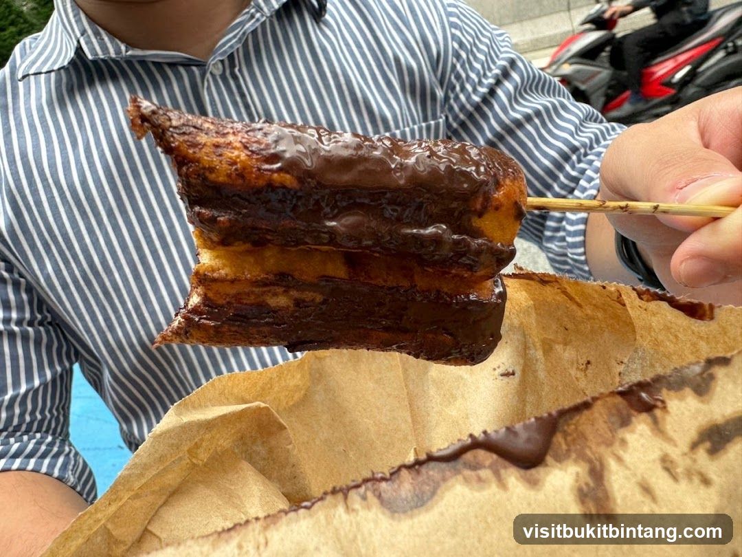 Chocolate-covered pastry on a skewer