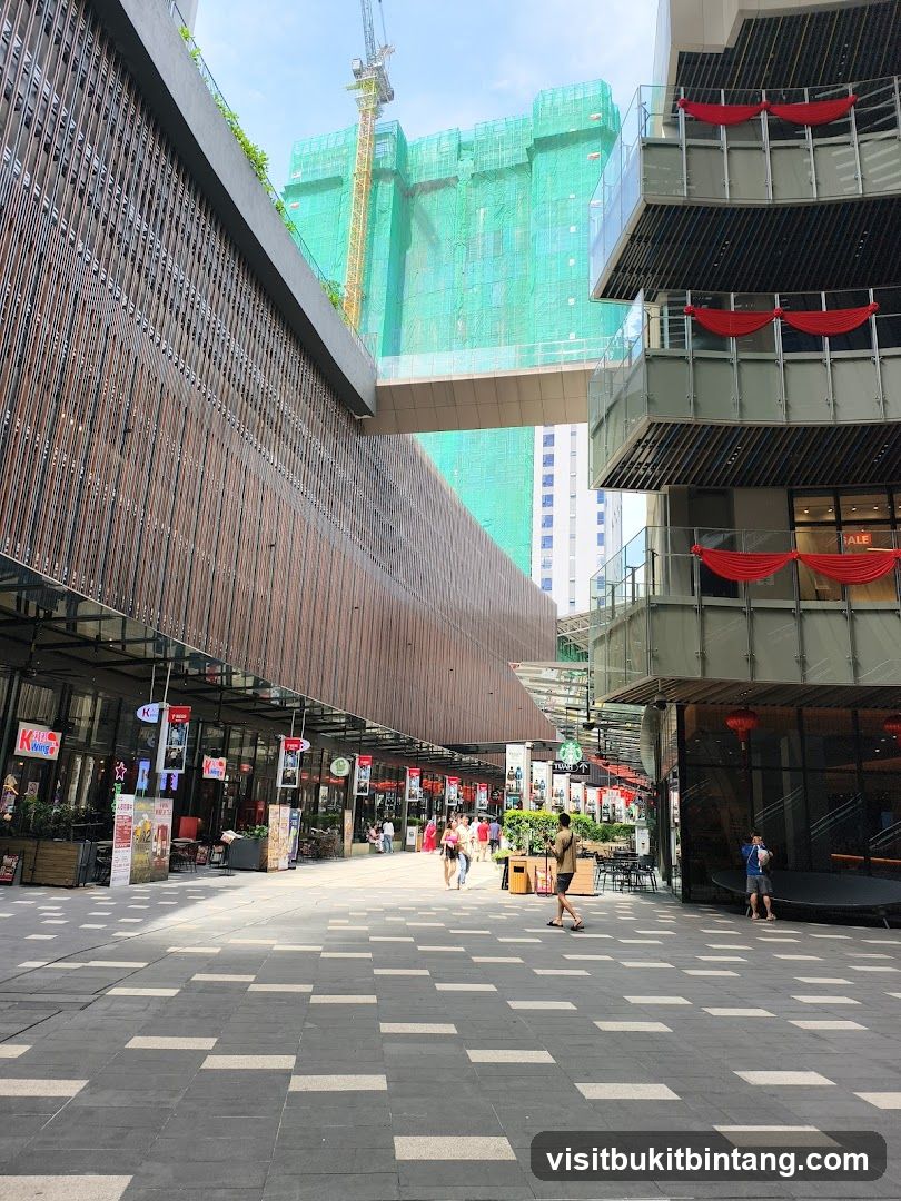 Outdoor walkway with shops and construction