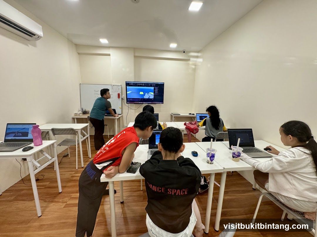 Children learning in a computer lab