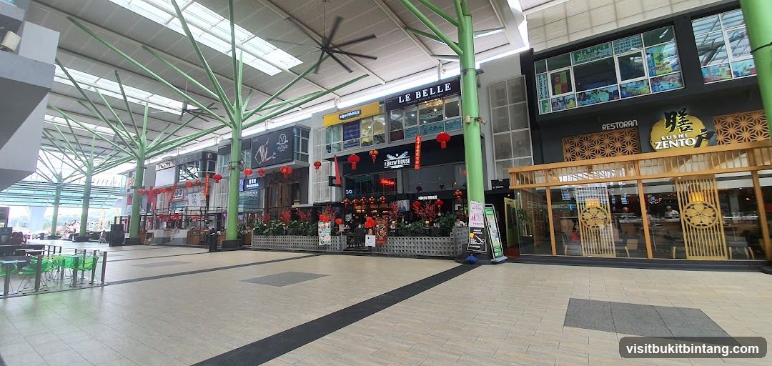 Outdoor shopping arcade with various restaurants and shops