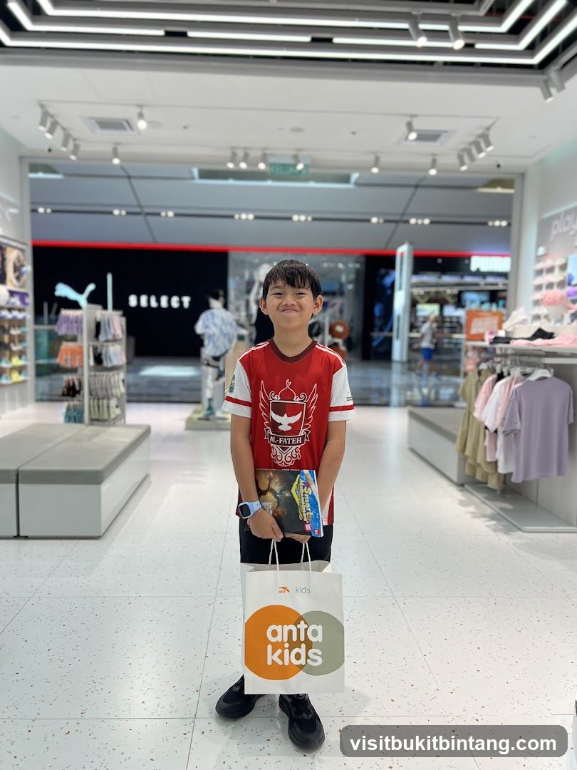 Boy holding shopping bag and book in store