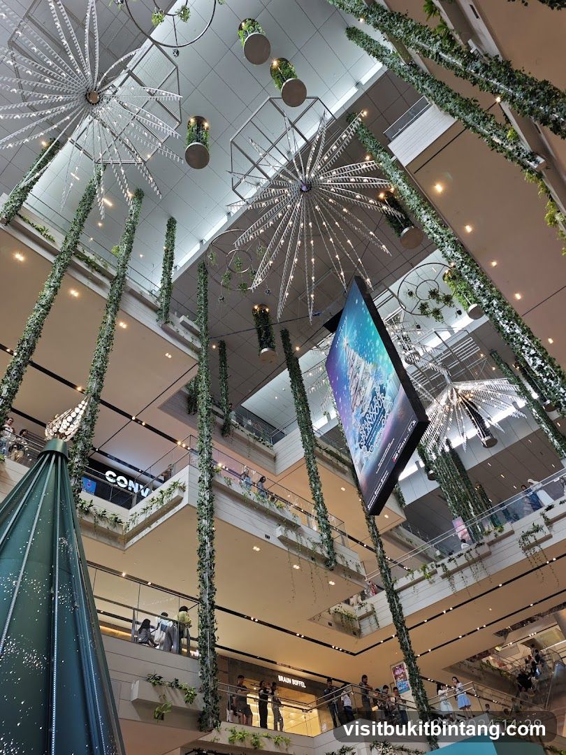Interior of a multi-level shopping mall with festive decorations