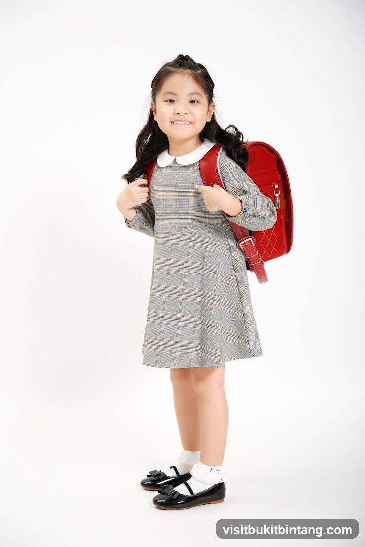 Young Girl with Red Backpack