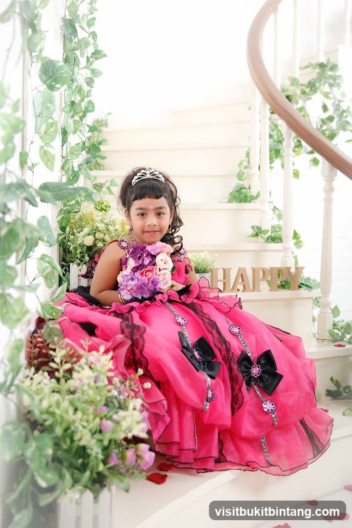 Girl in a pink dress with a tiara