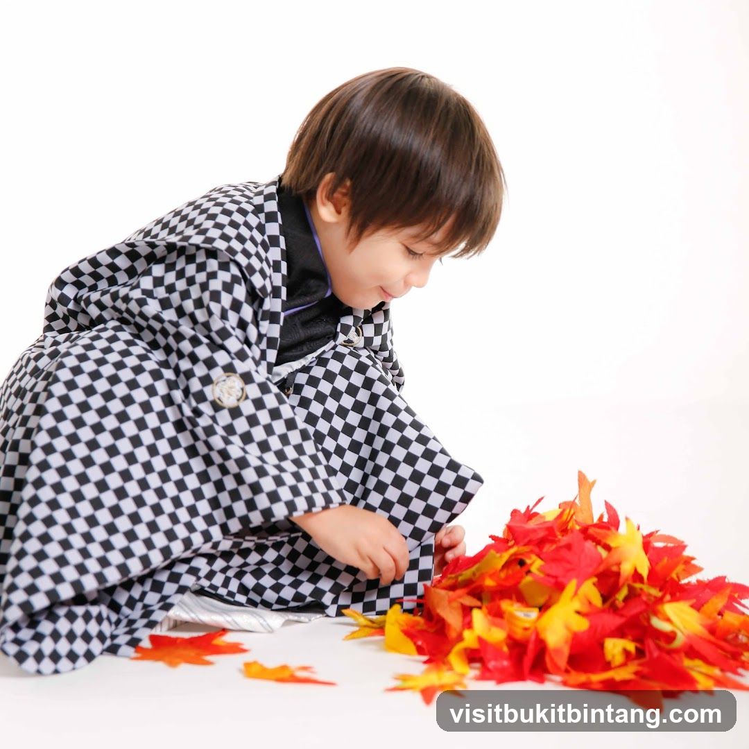 Boy in Kimono with Autumn Leaves