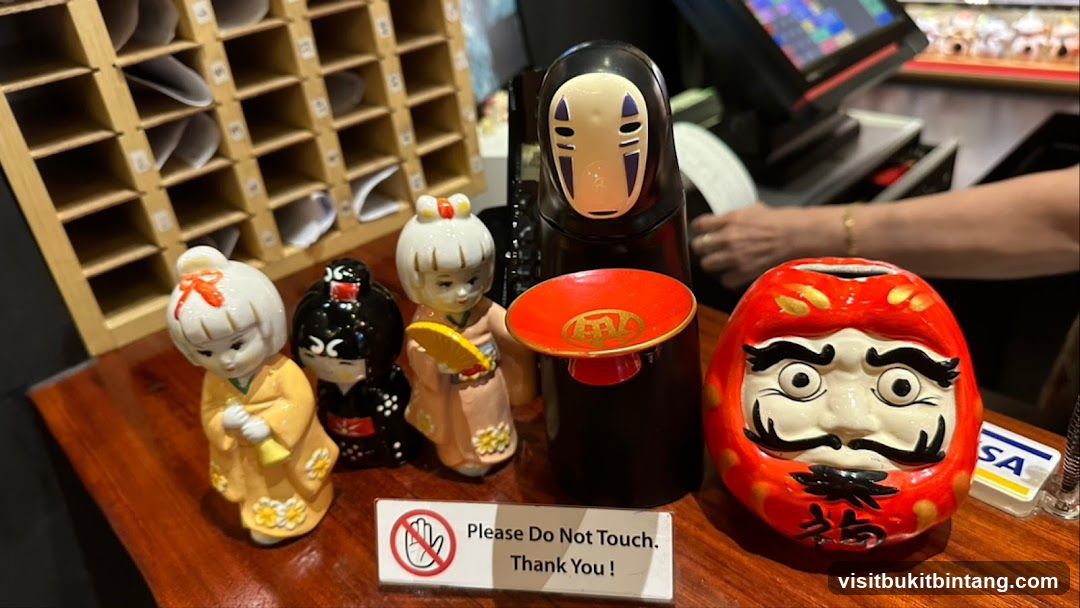 Decorative Figurines and Cash Register
