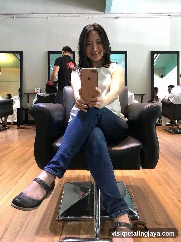 Woman Taking Selfie in Hair Salon