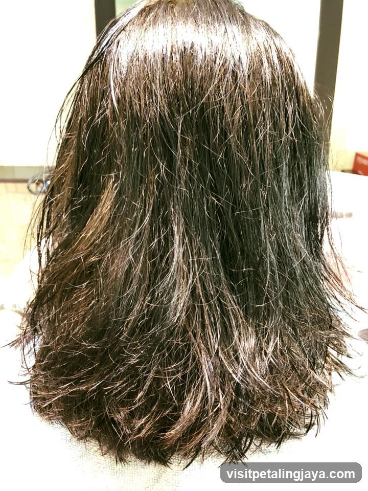 Back of a person with long, dark hair