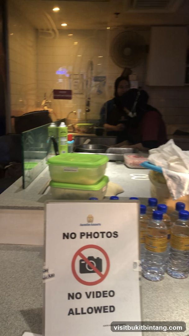 No Photos or Videos Allowed Sign