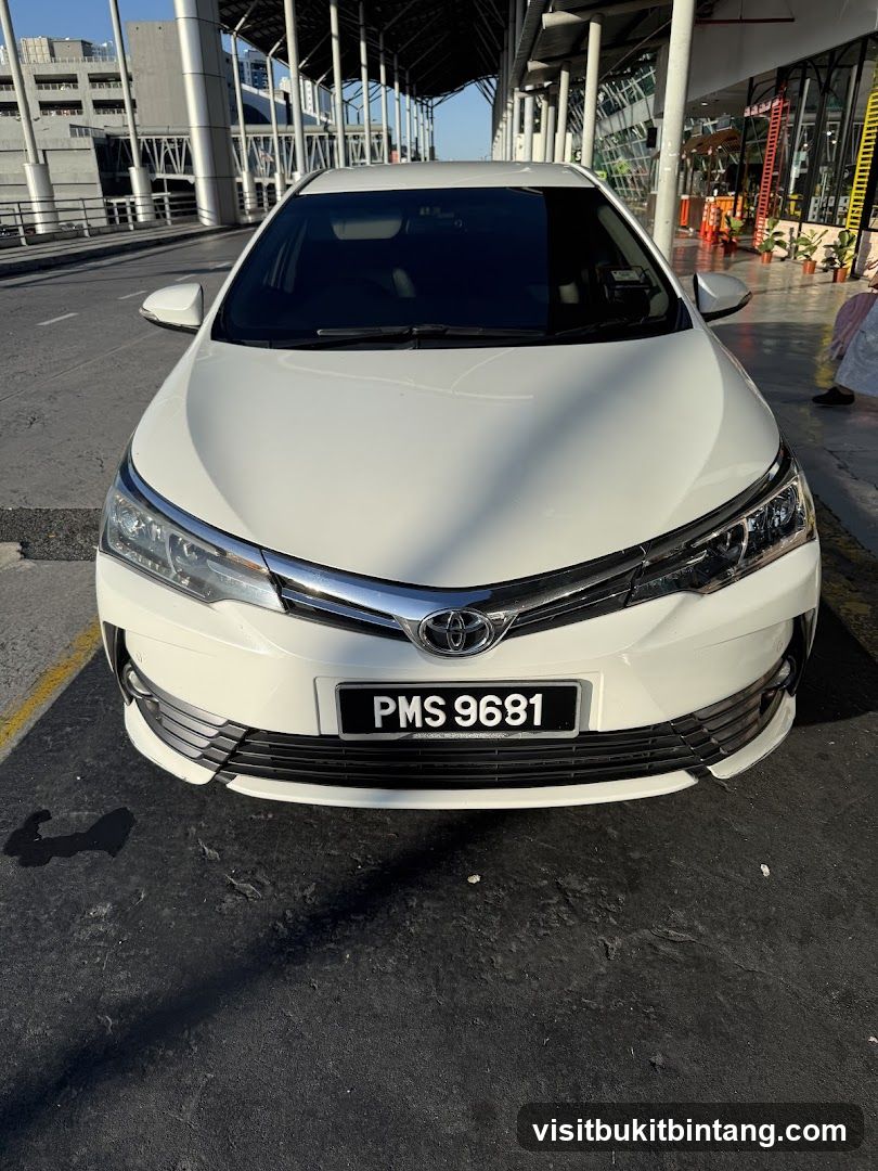 White Sedan with License Plate PMS 9681