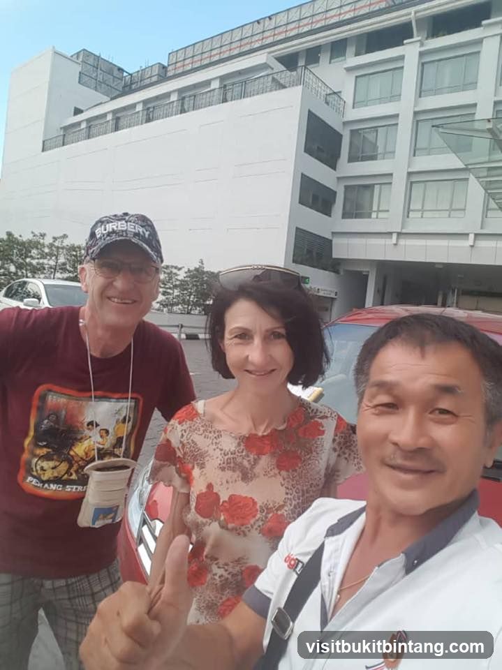 Three people posing for a selfie in front of a building