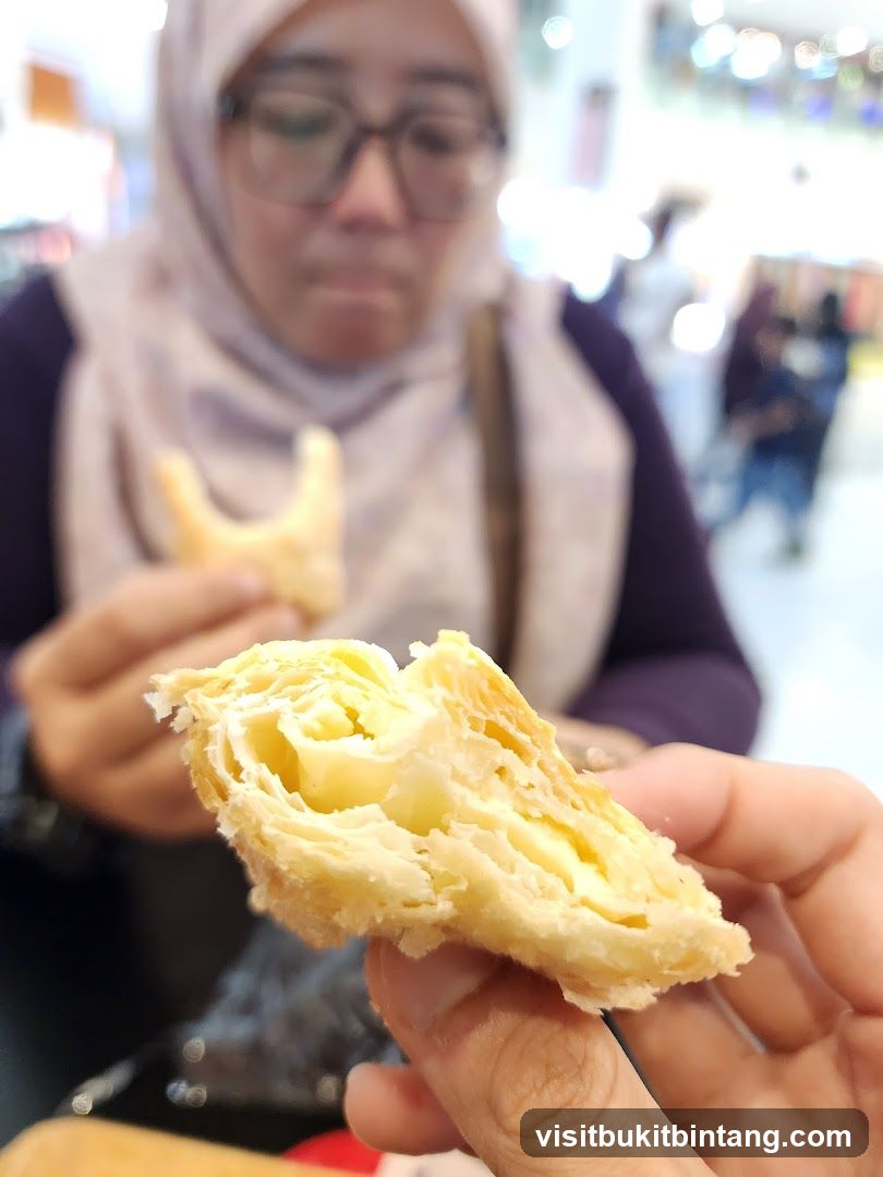Person holding a pastry